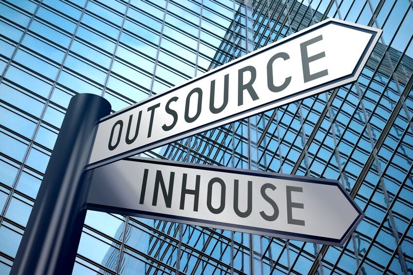 Signpost pointing to outsource or in-house IT, the decision for Singapore businesses with CARE